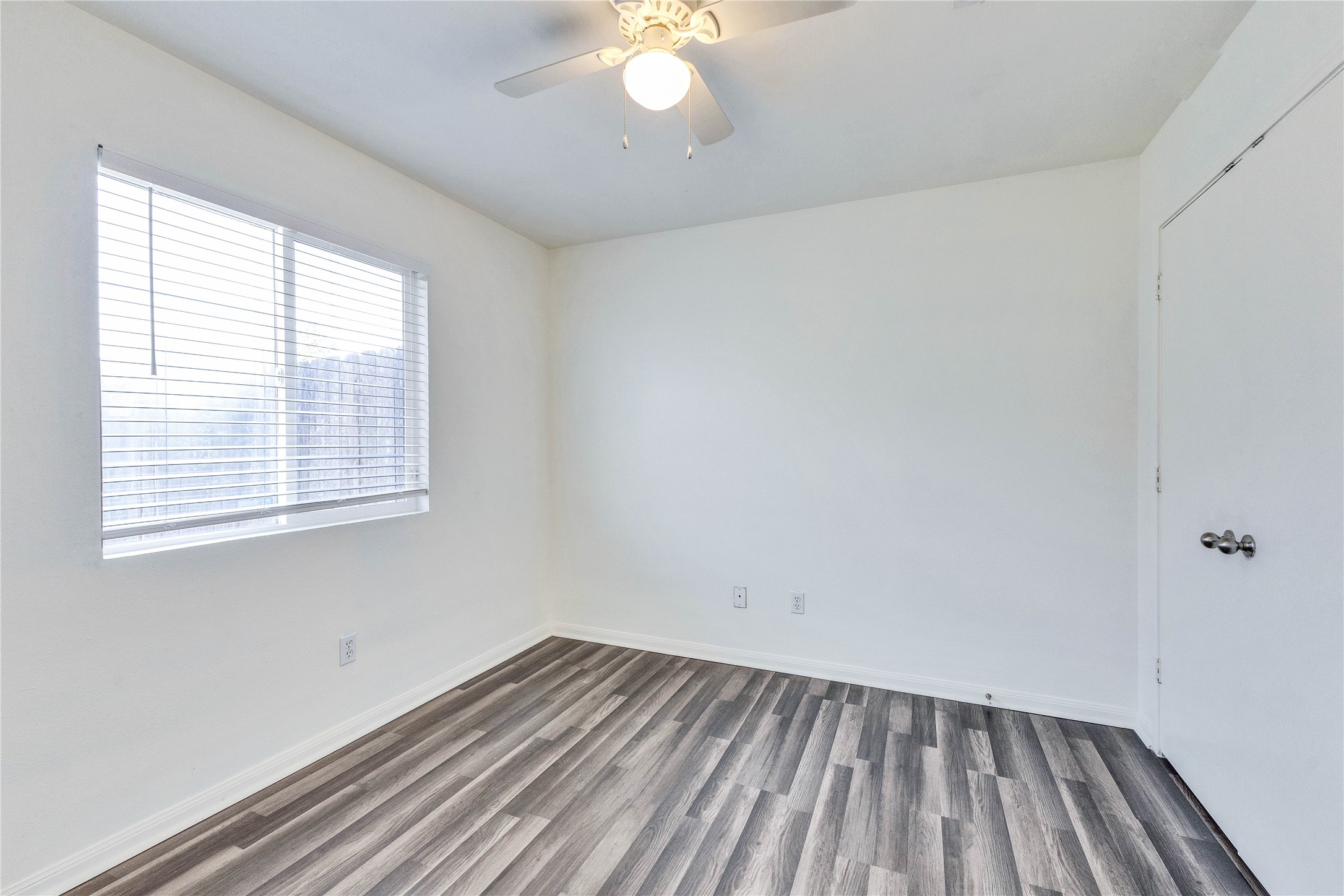1103 Madison Temple, TX 76504 - Photo 11 of 26 Empty room featuring dark wood-style floors and a ceiling fan