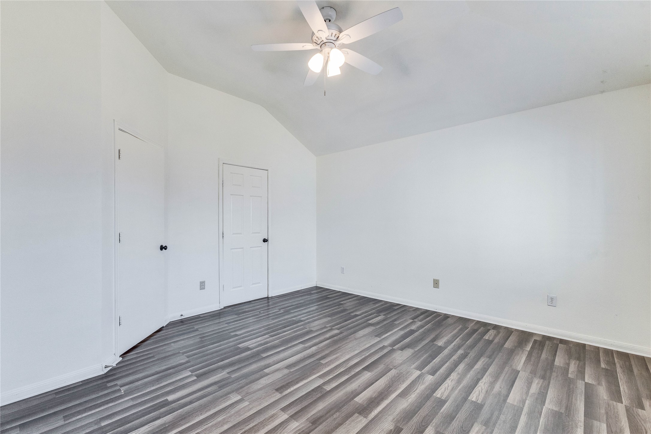 1103 Madison Temple, TX 76504 - Photo 13 of 26 Unfurnished bedroom featuring vaulted ceiling, dark wood-type flooring, and ceiling fan