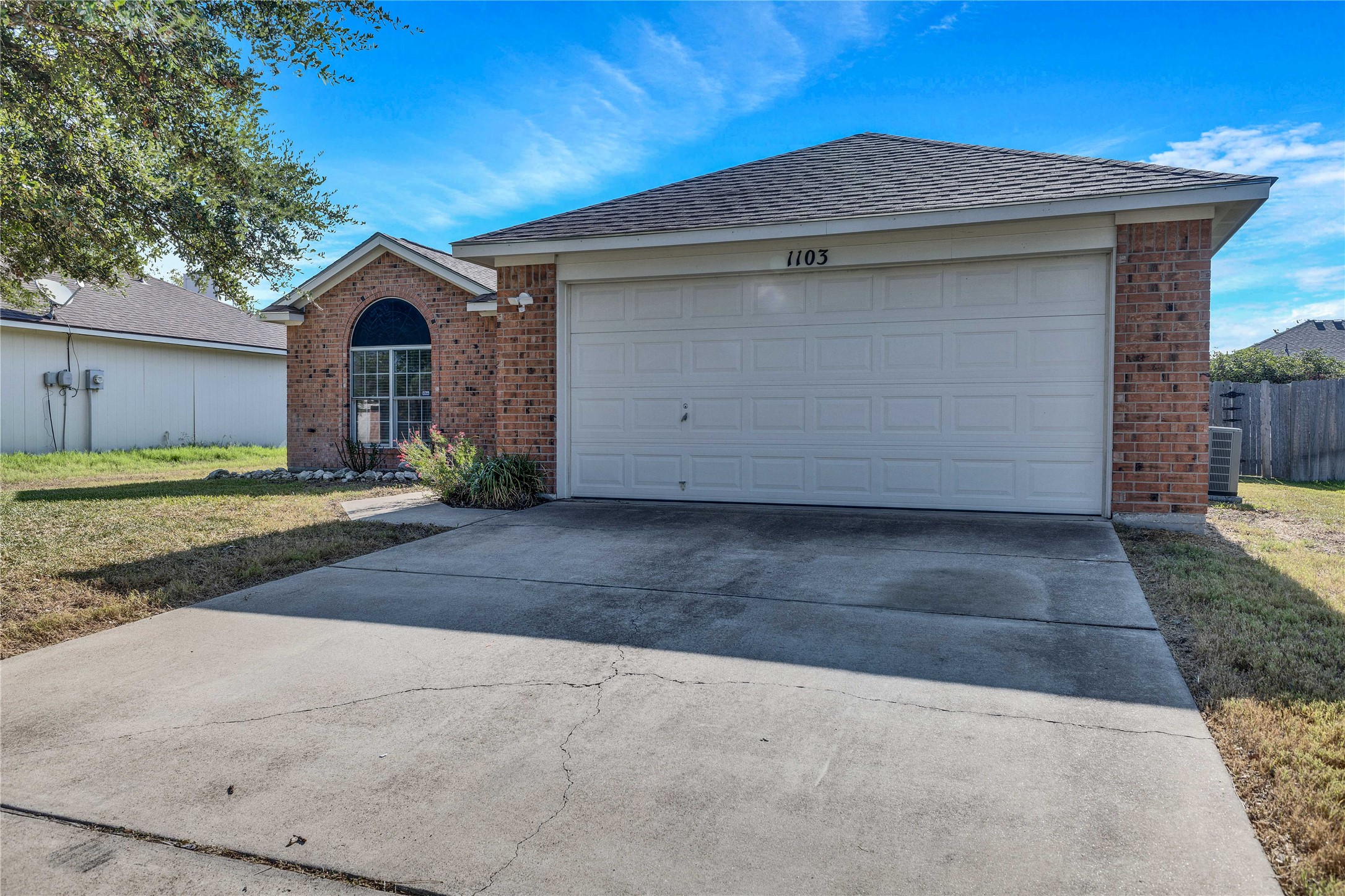 1103 Madison Temple, TX 76504 - Photo 24 of 26 Ranch-style home featuring brick siding, concrete driveway, and an attached garage