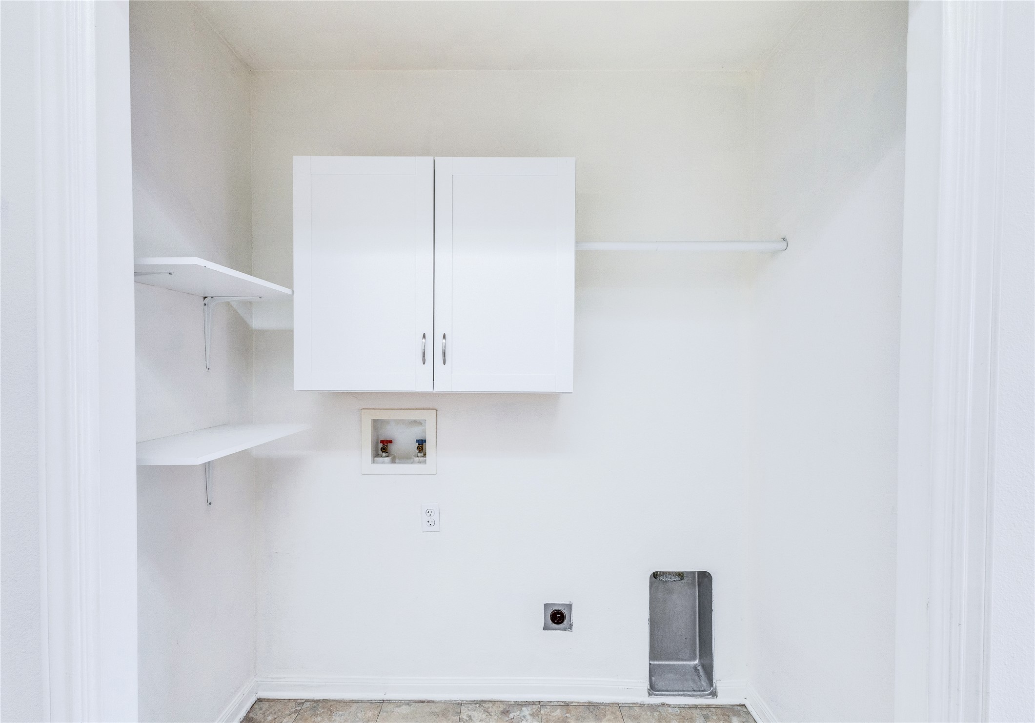1103 Madison Temple, TX 76504 - Photo 6 of 26 Laundry room featuring cabinet space, washer hookup, and hookup for an electric dryer