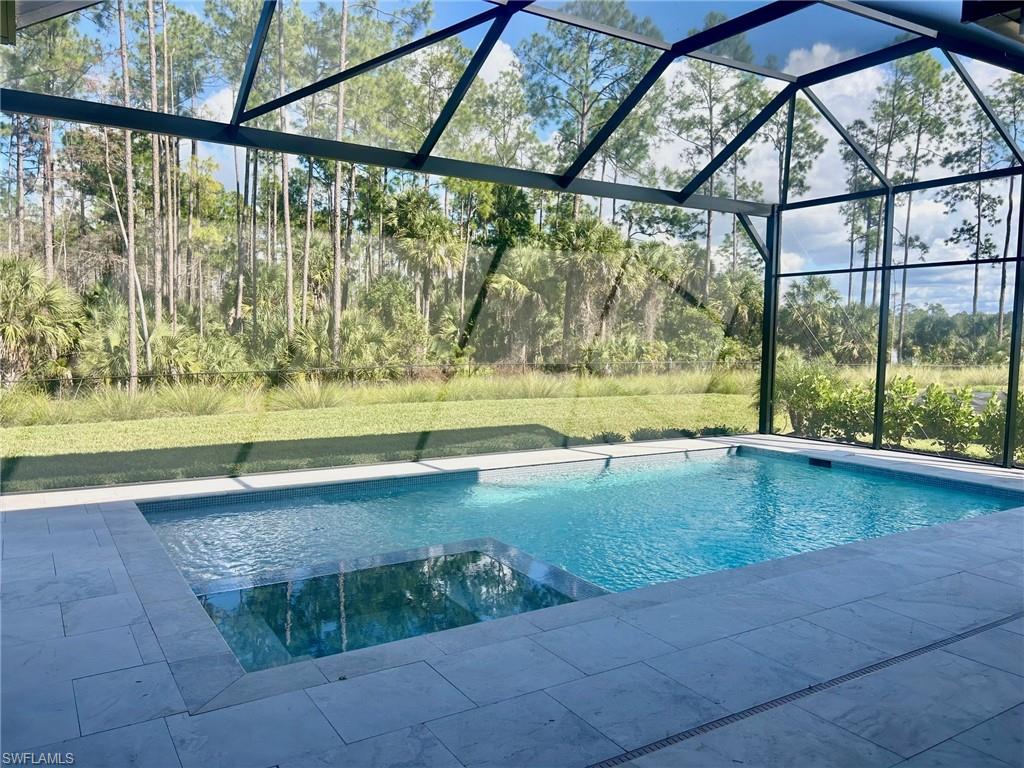 9587 Caymas Way Naples, FL 34114 - Photo 5 of 7 a view of a outdoor space