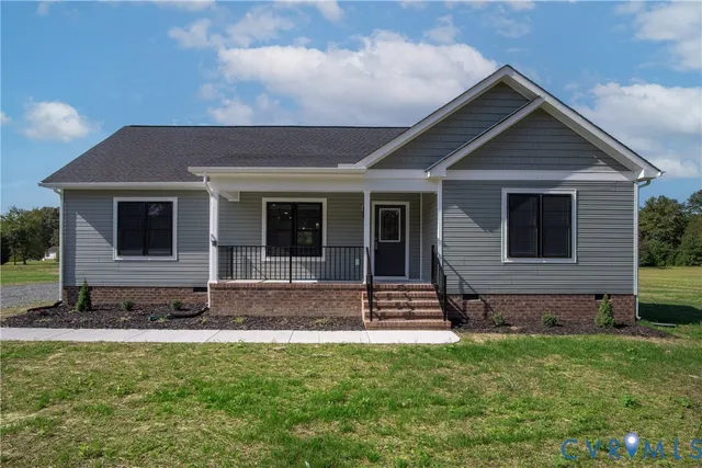 a view of front of house with a yard