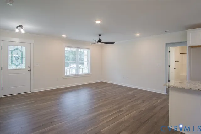 an empty room with a ceiling fan and a ceiling fan