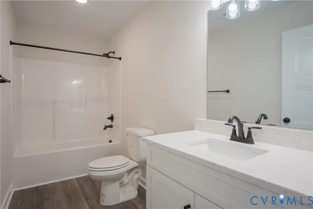 a view of room with hardwood floor