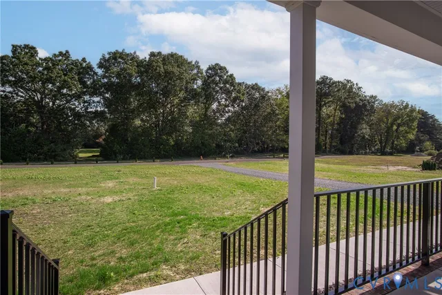 a kitchen with stainless steel appliances kitchen island granite countertop a stove a sink dishwasher a refrigerator and a wooden floor