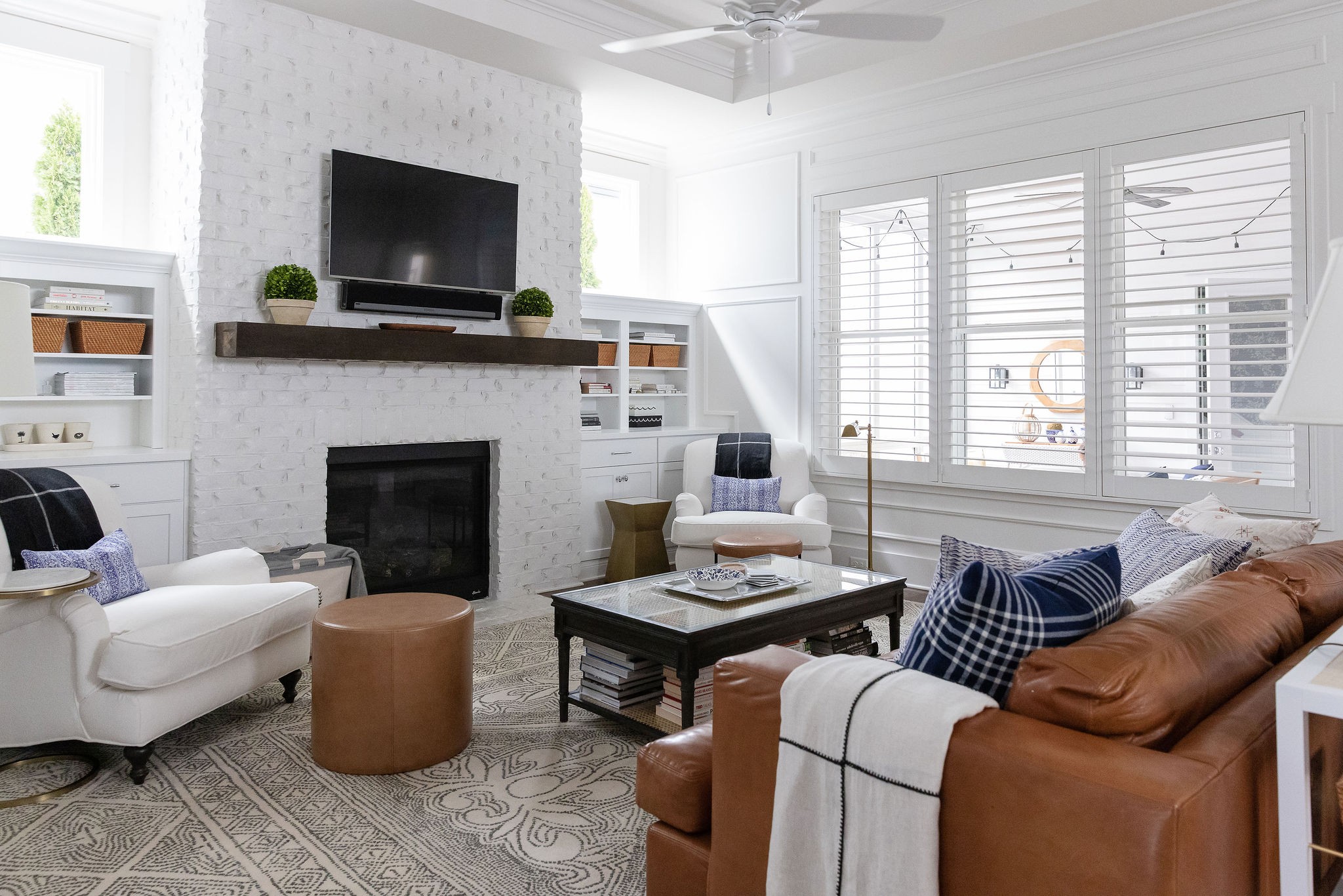 1507 Eliot Road Franklin, TN 37064 - Photo 19 of 67 a living room with furniture a flat screen tv and a fireplace