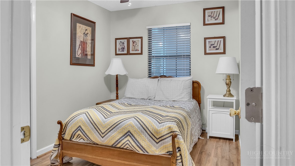117 Rhododendron Drive Beech Mountain, NC 28604 - Photo 28 of 33 a bedroom with a bed and a window