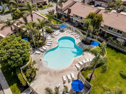 an aerial view of a backyard with outdoor seating
