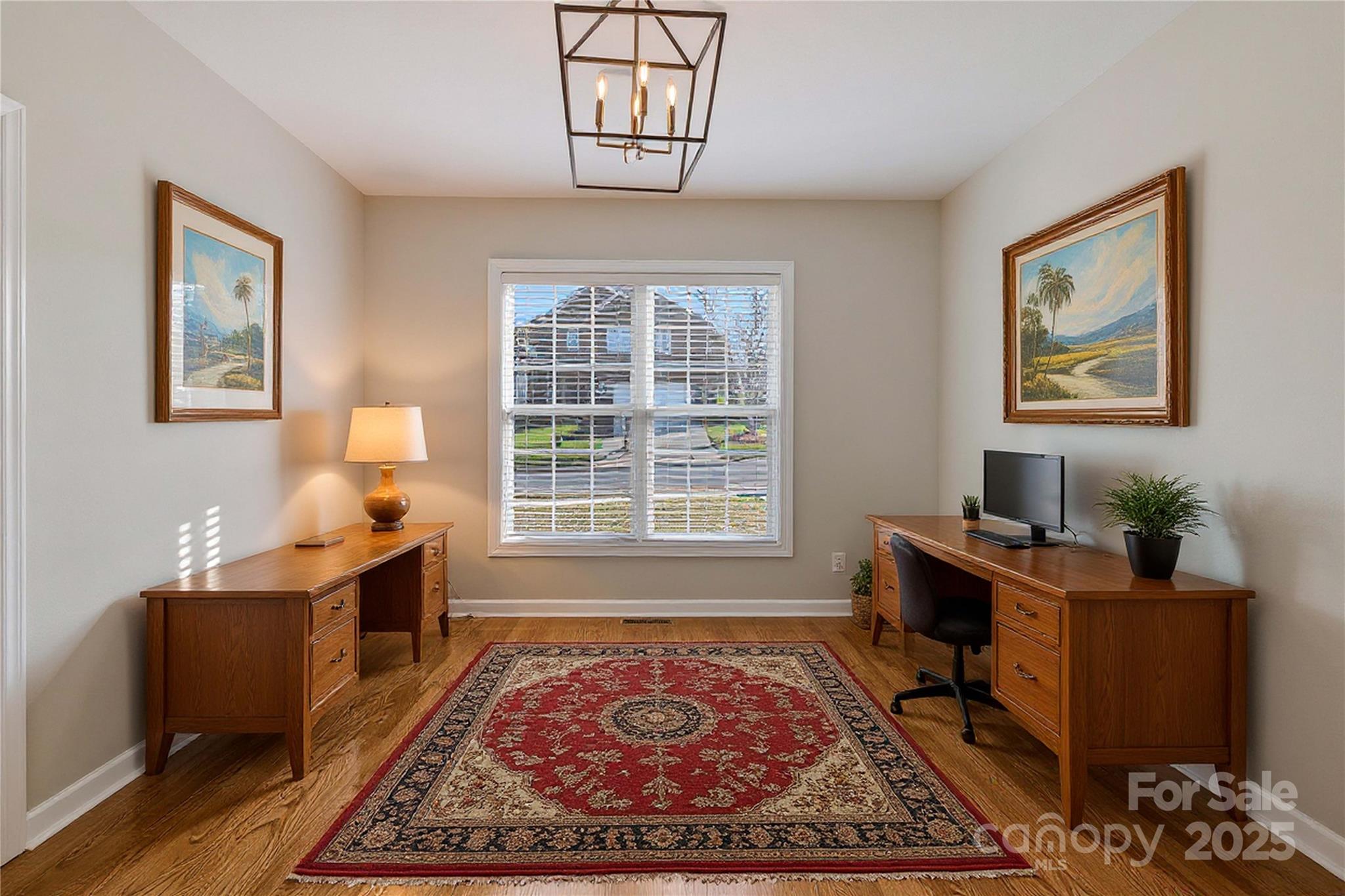 3214 Grandeur Road Charlotte, NC 28269 - Photo 5 of 18 a view of a workspace with furniture and a window