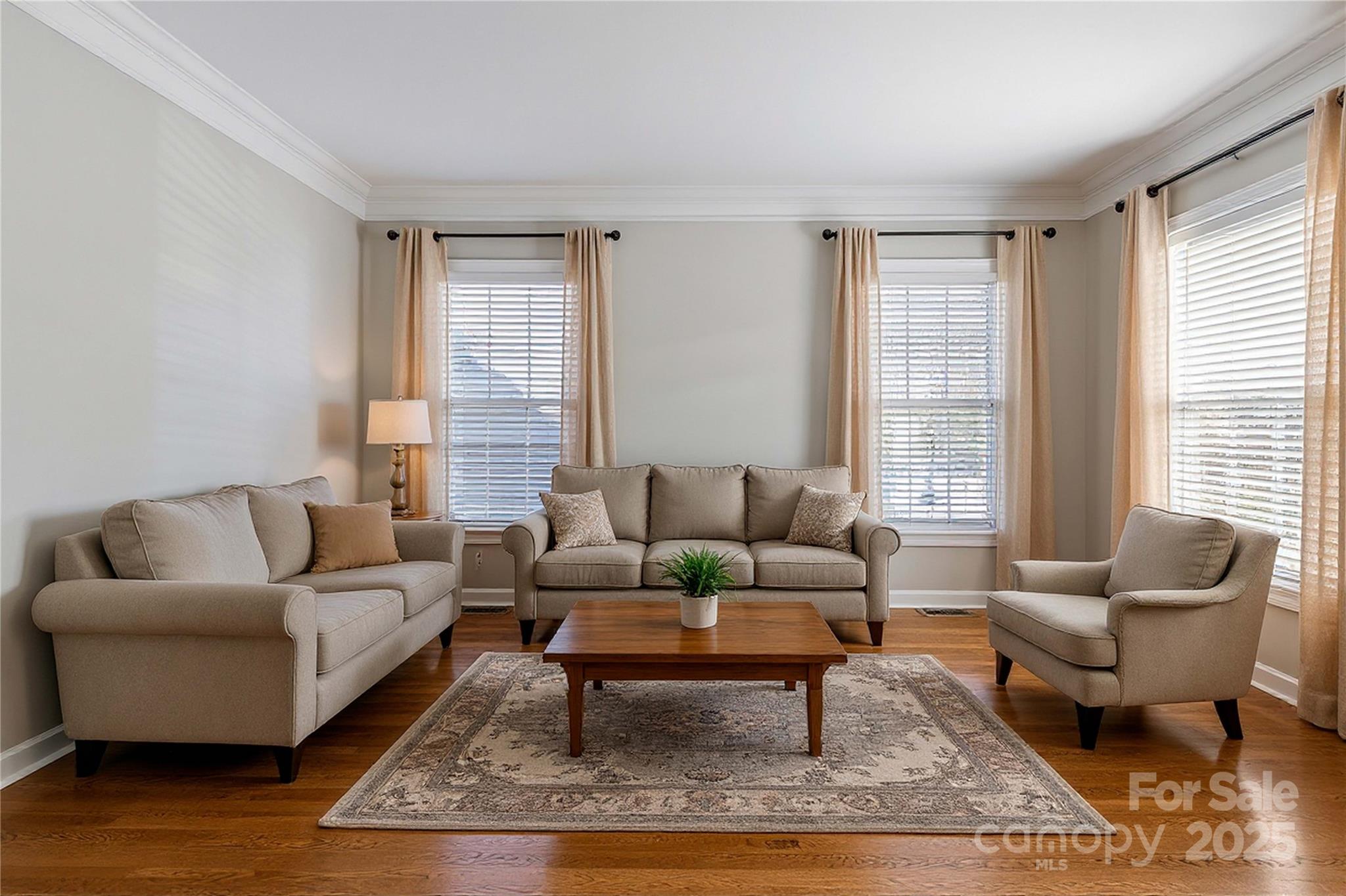 3214 Grandeur Road Charlotte, NC 28269 - Photo 7 of 18 a living room with furniture wooden floor and a large window