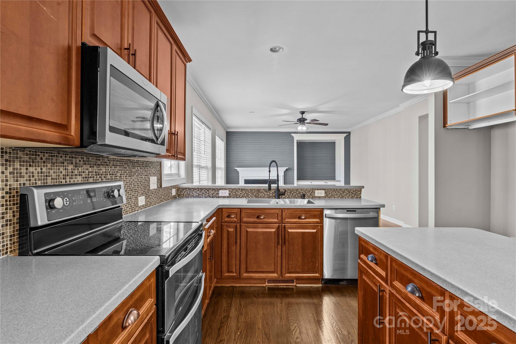3214 Grandeur Road Charlotte, NC 28269 - Photo 10 of 18 a kitchen with stainless steel appliances granite countertop a sink stove and refrigerator