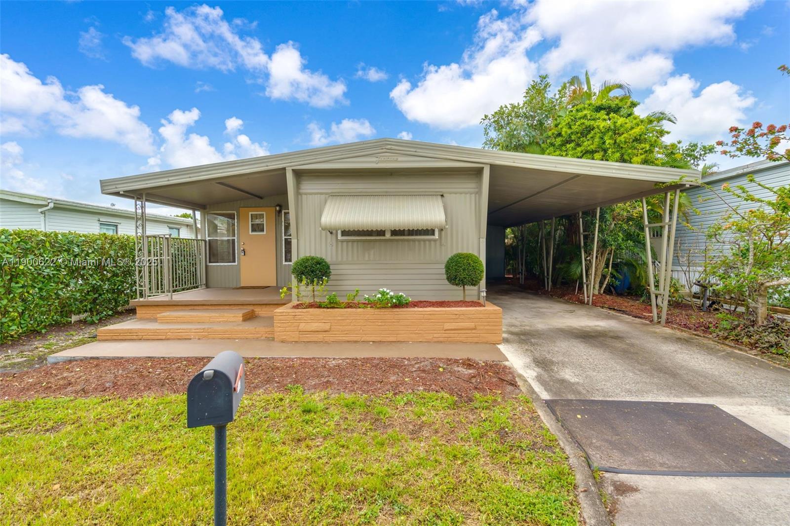 8360 Southwest 21st Street Davie, FL 33324 - Photo 1 of 33 a front view of a house with garden