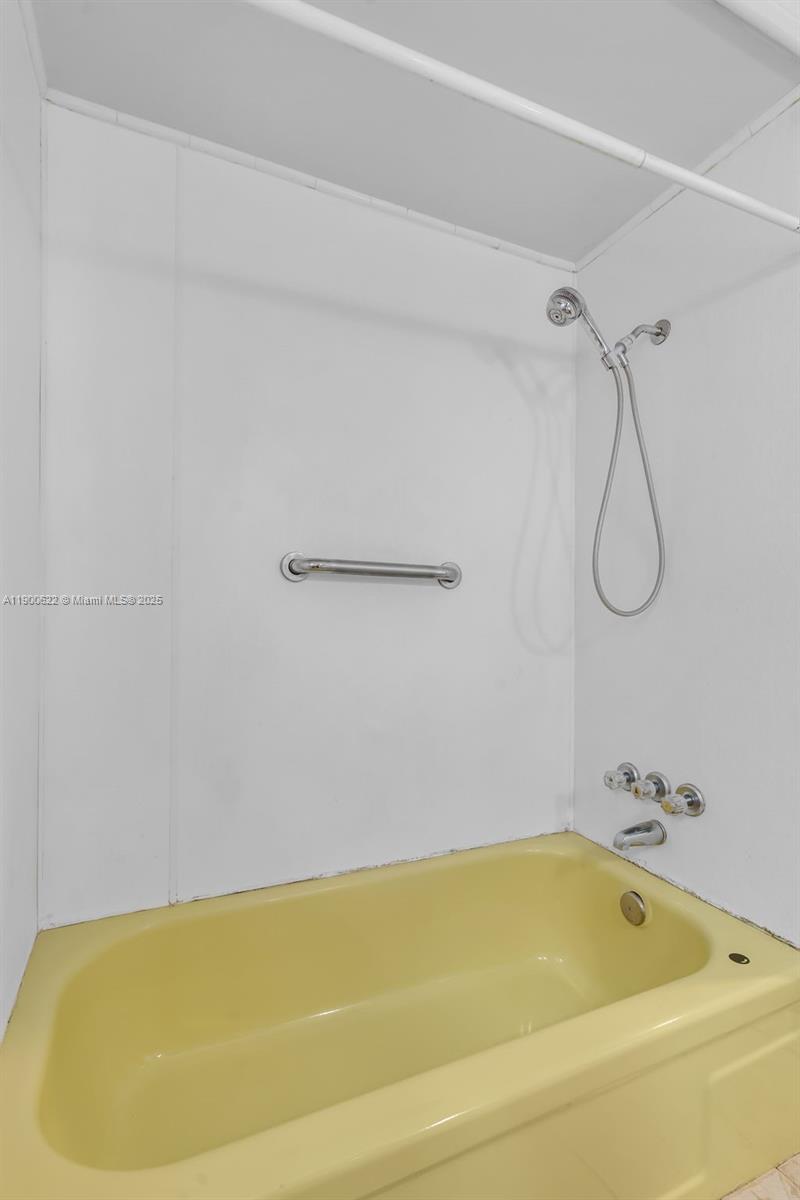 8360 Southwest 21st Street Davie, FL 33324 - Photo 11 of 33 a bathroom with a bath tub with a shower