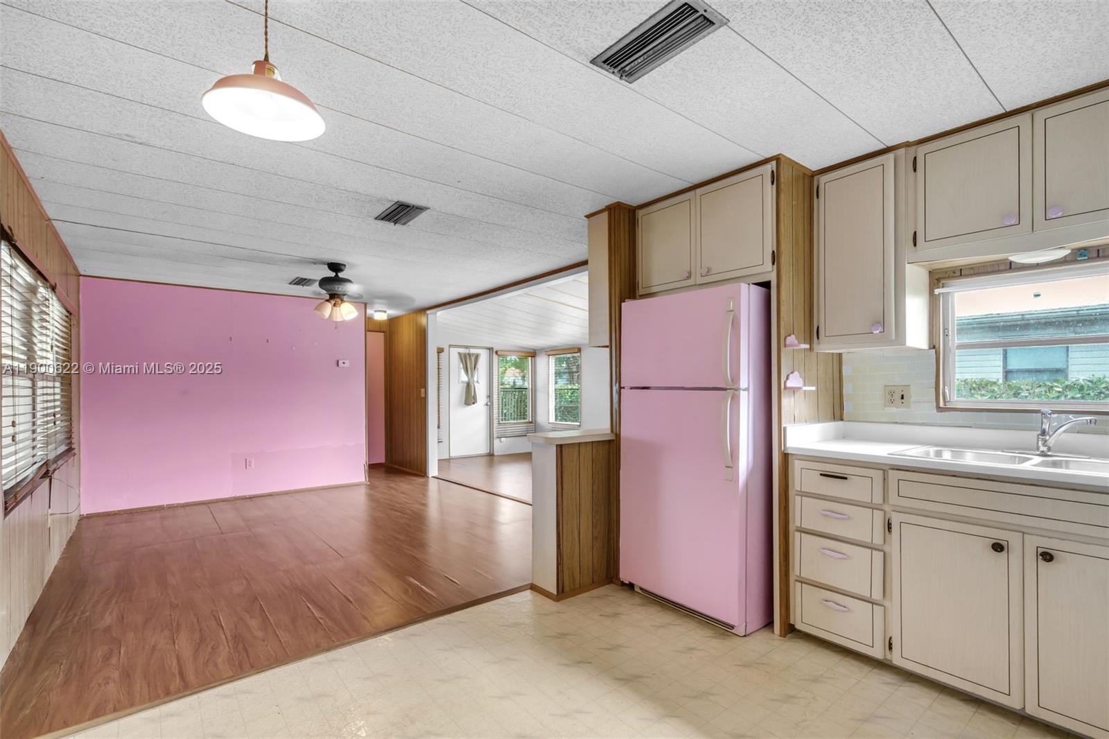 8360 Southwest 21st Street Davie, FL 33324 - Photo 12 of 33 a open kitchen with stainless steel appliances granite countertop a refrigerator and microwave