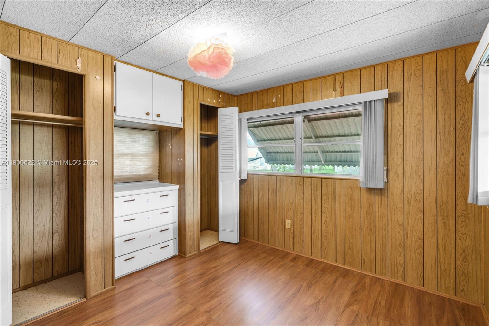 8360 Southwest 21st Street Davie, FL 33324 - Photo 15 of 33 a view of walk in closet with wooden floor