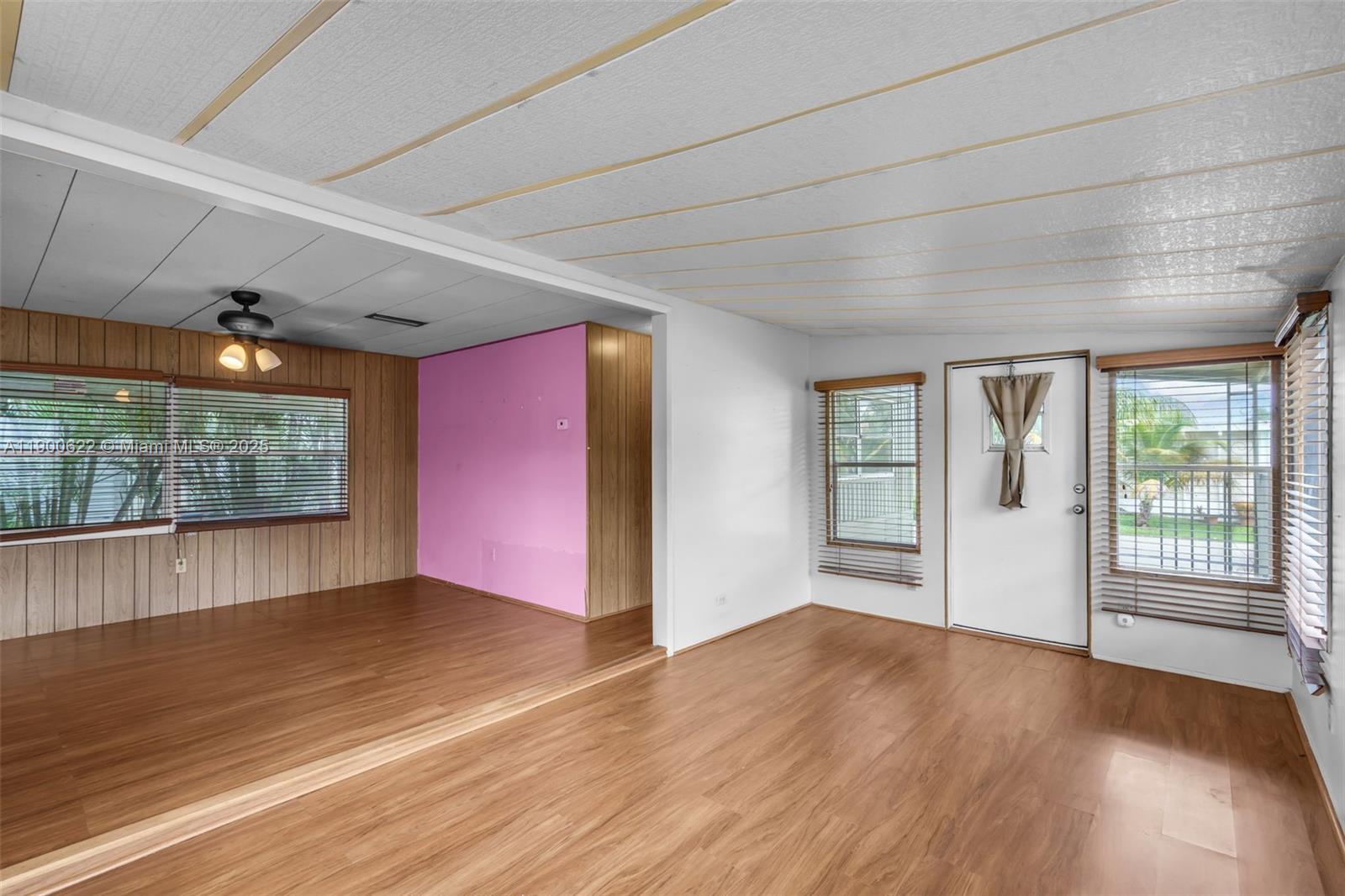 8360 Southwest 21st Street Davie, FL 33324 - Photo 4 of 33 an empty room with wooden floor and windows