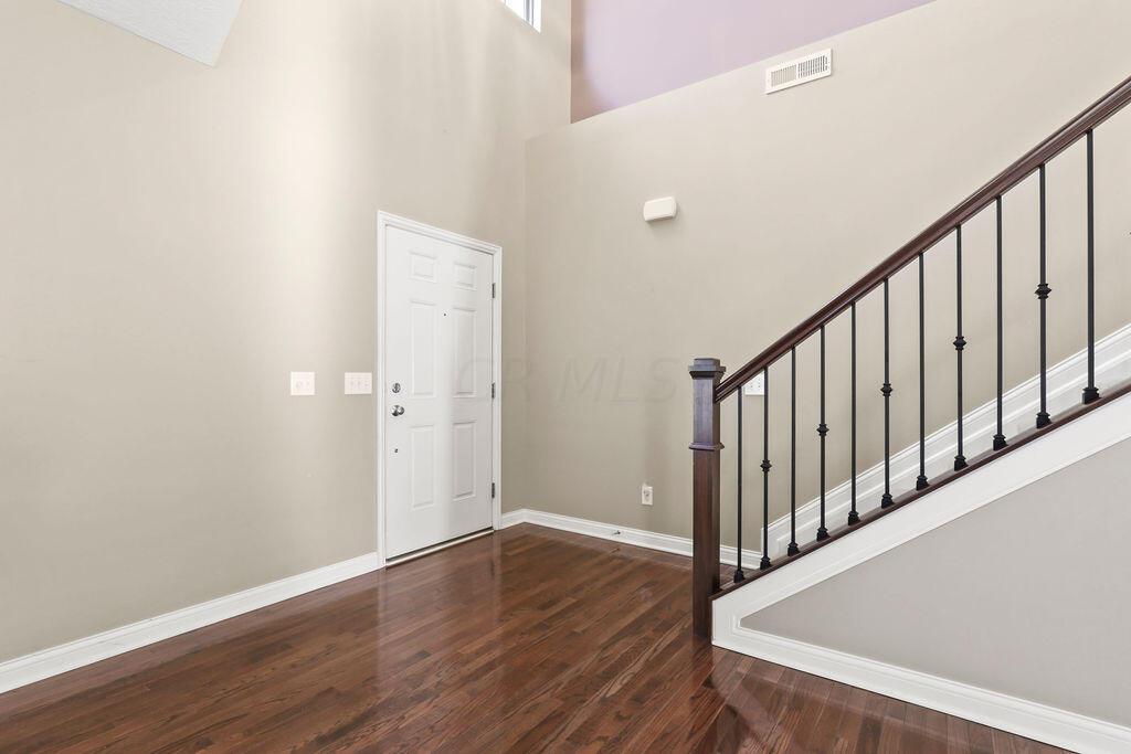 6163 Jennis Road Westerville, OH 43081 - Photo 2 of 44 • Hardwood flooring
• Tan painted walls
• Chandelier
• Two story ceiling
• Plant ledge
• Open to Great Room