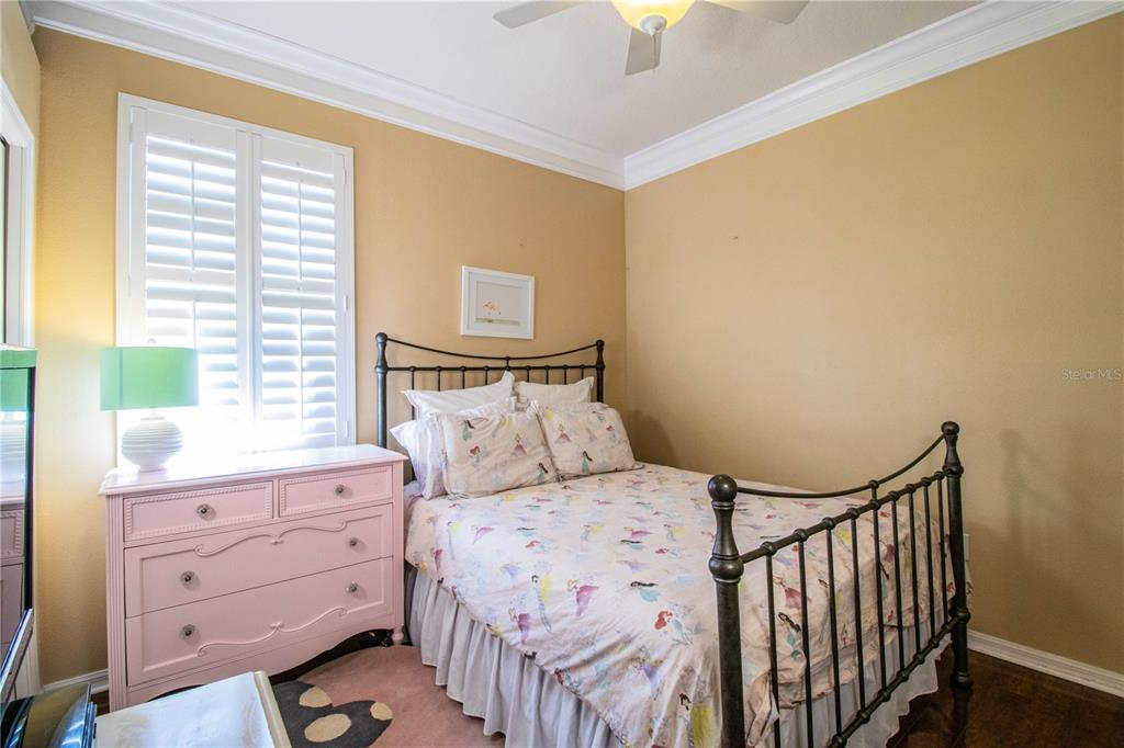 3234 Stonebridge Trail Valrico, FL 33596 - Photo 23 of 34 a bedroom with a bed and a window