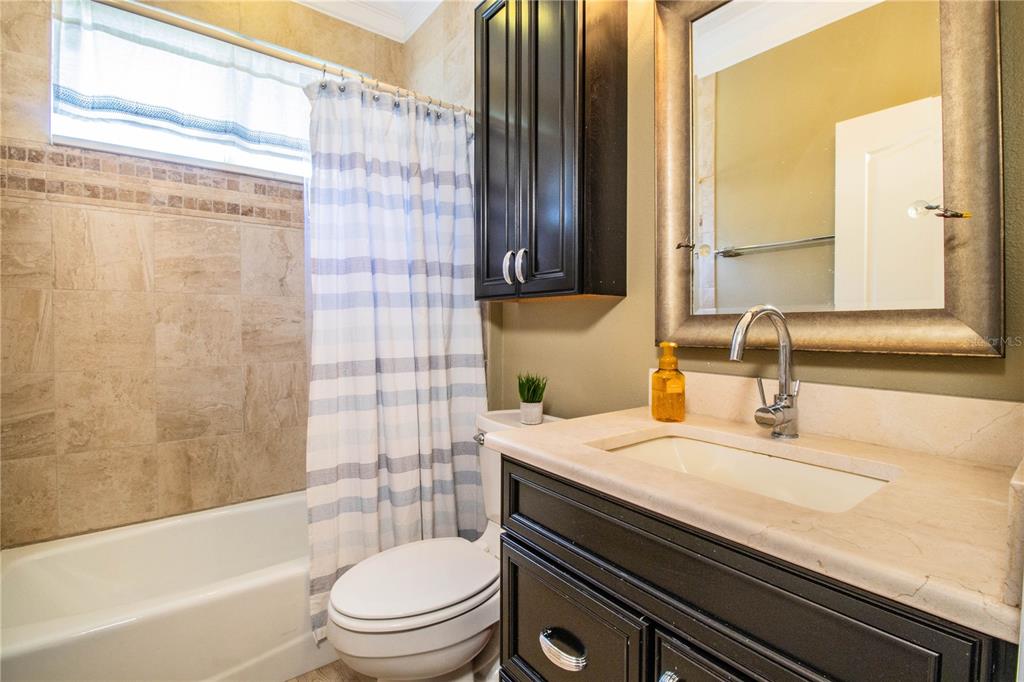 3234 Stonebridge Trail Valrico, FL 33596 - Photo 25 of 34 a bathroom with a sink a toilet and shower