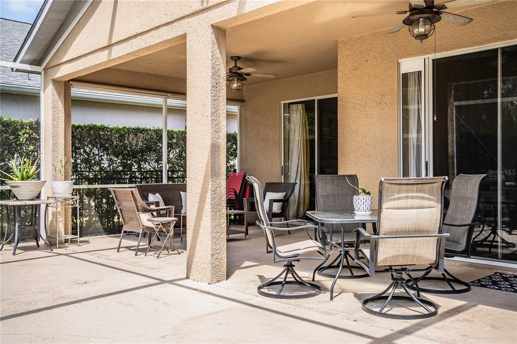 3234 Stonebridge Trail Valrico, FL 33596 - Photo 28 of 34 a view of a workspace with furniture and floor to ceiling window