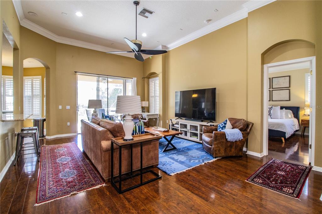 3234 Stonebridge Trail Valrico, FL 33596 - Photo 3 of 34 a living room with furniture flat screen tv and a fireplace