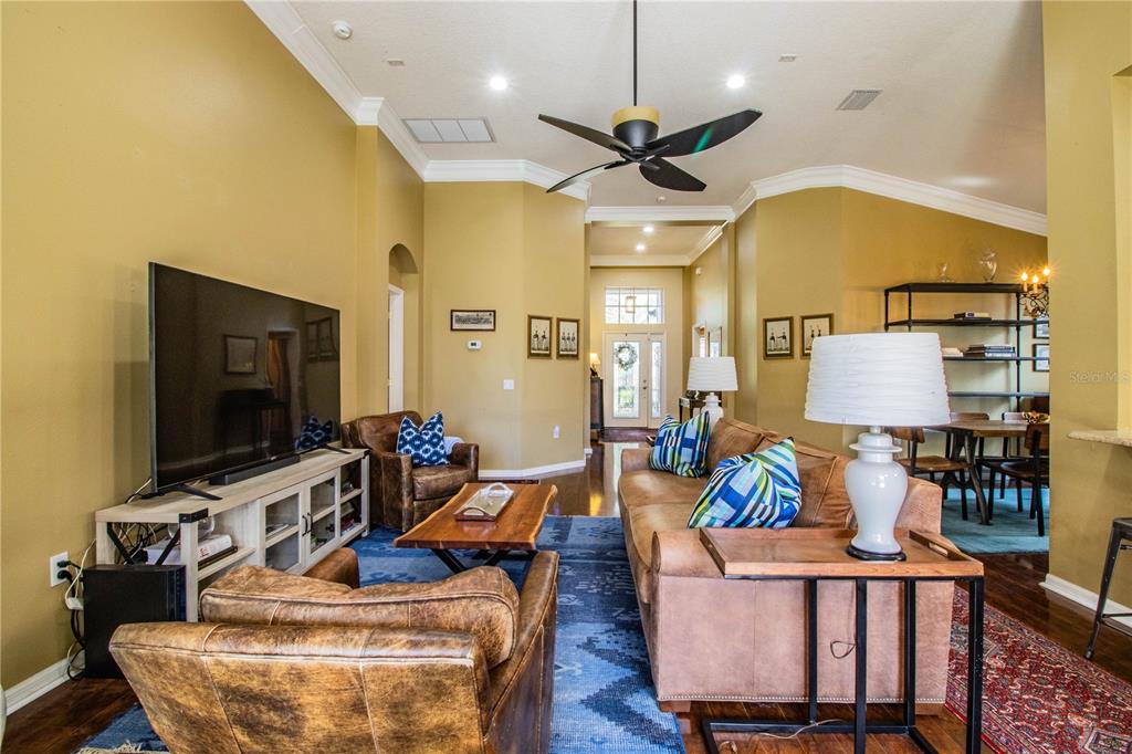 3234 Stonebridge Trail Valrico, FL 33596 - Photo 7 of 34 a living room with furniture and a flat screen tv