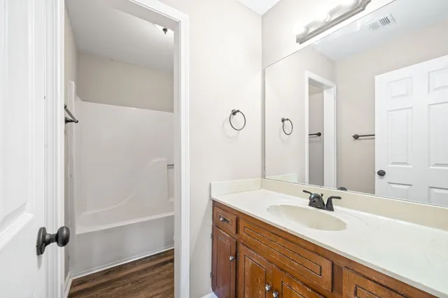 a bathroom with a sink and a mirror