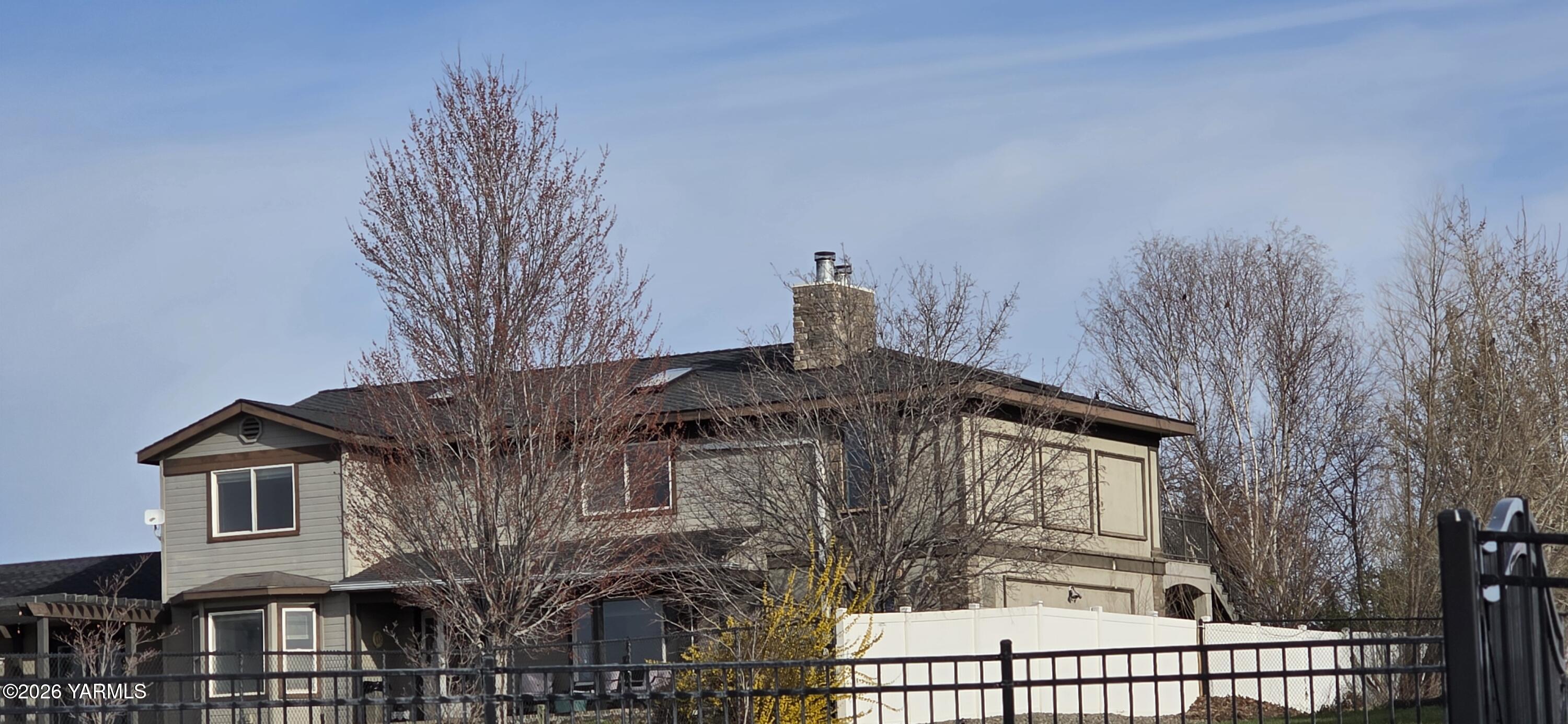 8601 Scenic Drive Yakima, WA 98908 - Photo 3 of 52 a view of a house with a iron gate