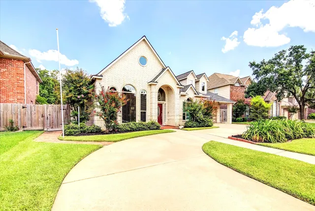 a view of a house with palm trees