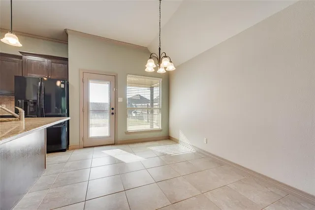 a view of a kitchen with a sink and window
