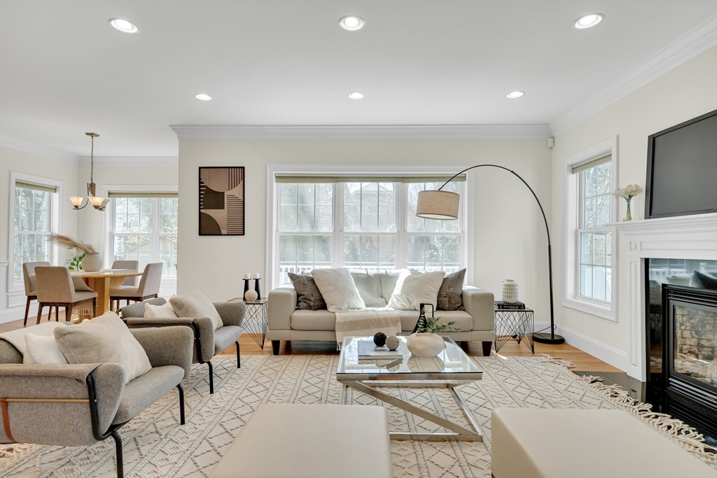 19 Bryn Mawr Road Wellesley, MA 02482 - Photo 12 of 42 a living room with furniture or fireplace and a flat screen tv