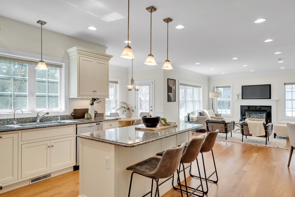 19 Bryn Mawr Road Wellesley, MA 02482 - Photo 16 of 42 a kitchen with lots of counter space sink and living room view