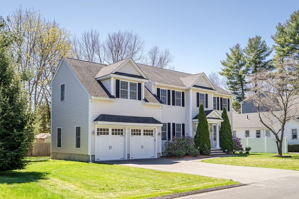 19 Bryn Mawr Road Wellesley, MA 02482 - Photo 2 of 42 a view of a white house next to a yard with large trees