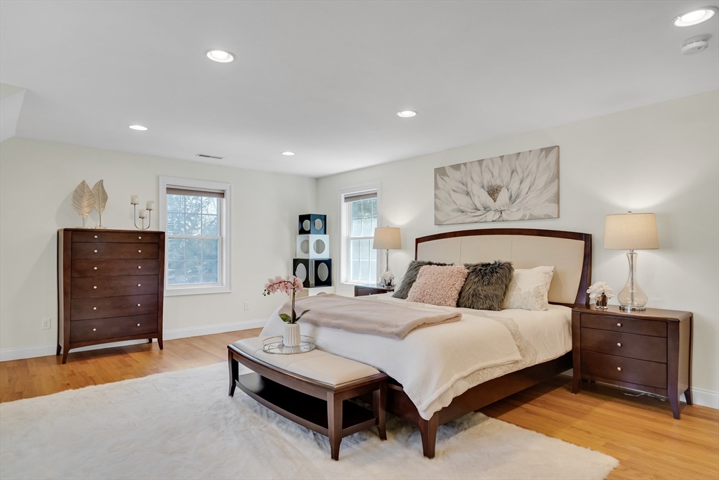 19 Bryn Mawr Road Wellesley, MA 02482 - Photo 21 of 42 a bedroom with a bed and wooden floor