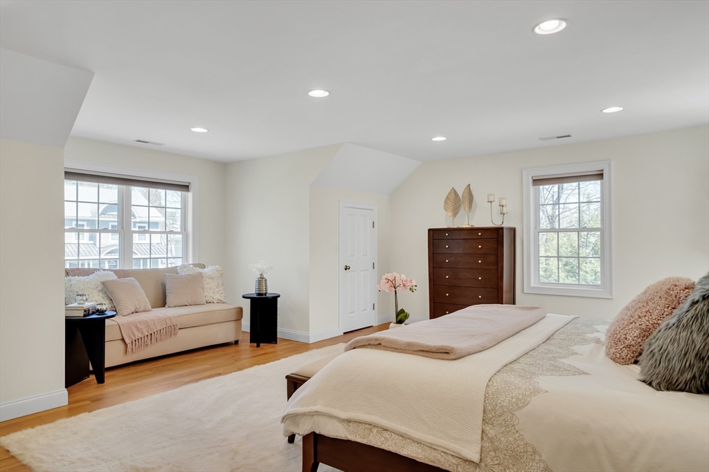 19 Bryn Mawr Road Wellesley, MA 02482 - Photo 22 of 42 a bedroom with a bed and a couch