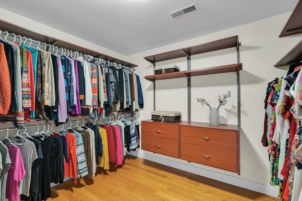 19 Bryn Mawr Road Wellesley, MA 02482 - Photo 24 of 42 a view of walk in closet with clothes