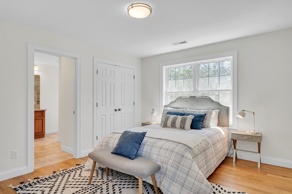 19 Bryn Mawr Road Wellesley, MA 02482 - Photo 27 of 42 a bedroom with a bed and wooden floor