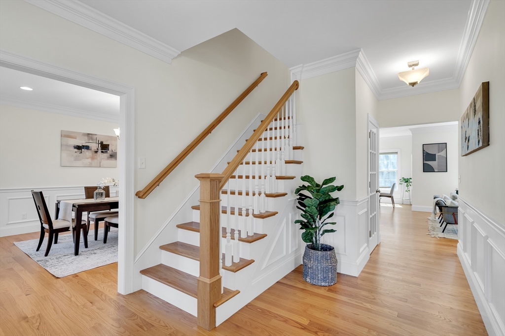 19 Bryn Mawr Road Wellesley, MA 02482 - Photo 3 of 42 a view of an entryway with wooden floor and vase sitting on a table