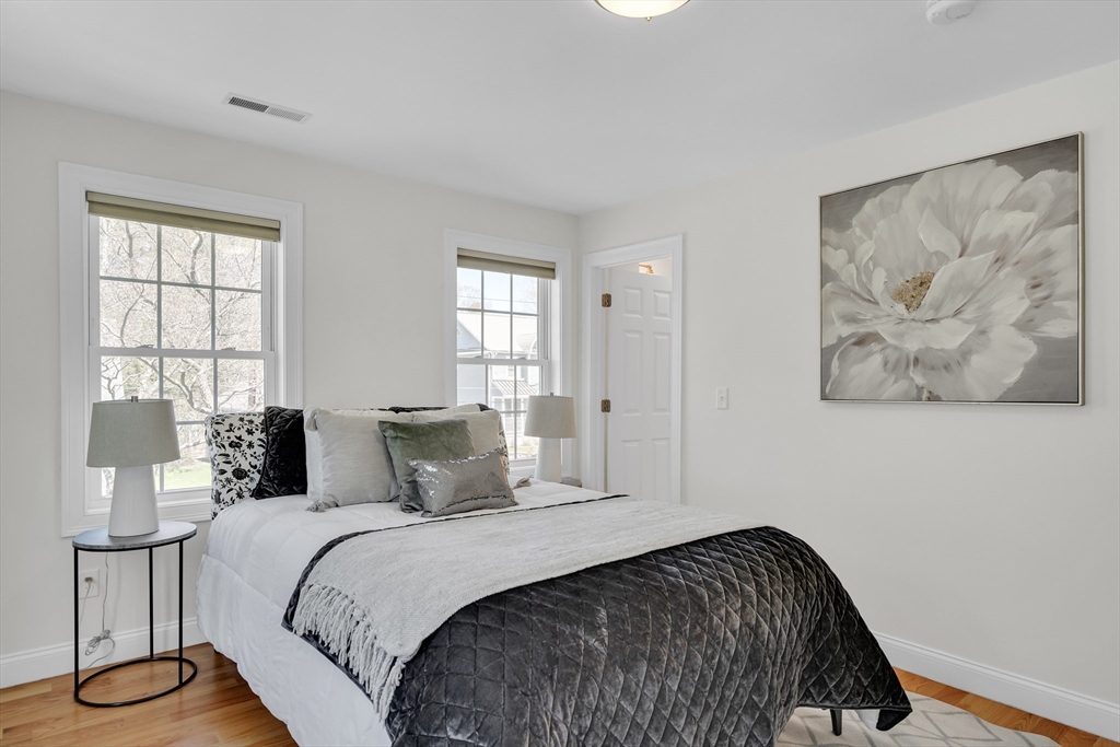 19 Bryn Mawr Road Wellesley, MA 02482 - Photo 31 of 42 a bedroom with a bed and wooden floor