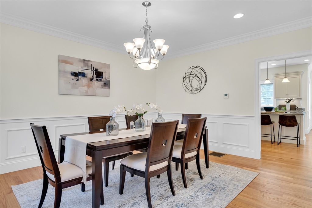 19 Bryn Mawr Road Wellesley, MA 02482 - Photo 5 of 42 a view of a dining room with furniture and wooden floor