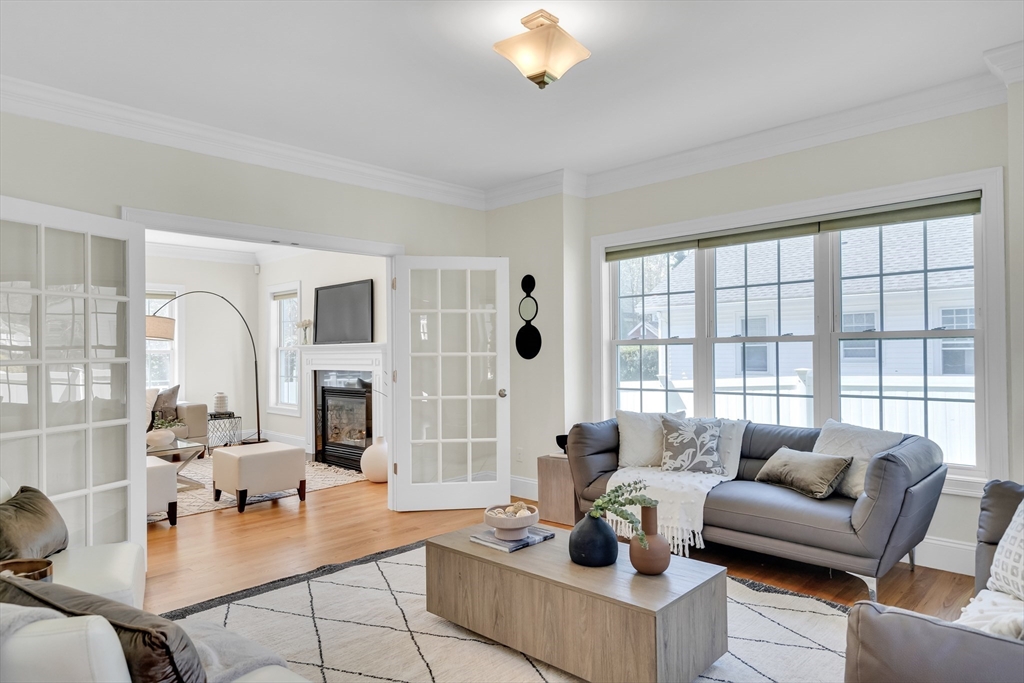 19 Bryn Mawr Road Wellesley, MA 02482 - Photo 8 of 42 a living room with fireplace furniture and a large window