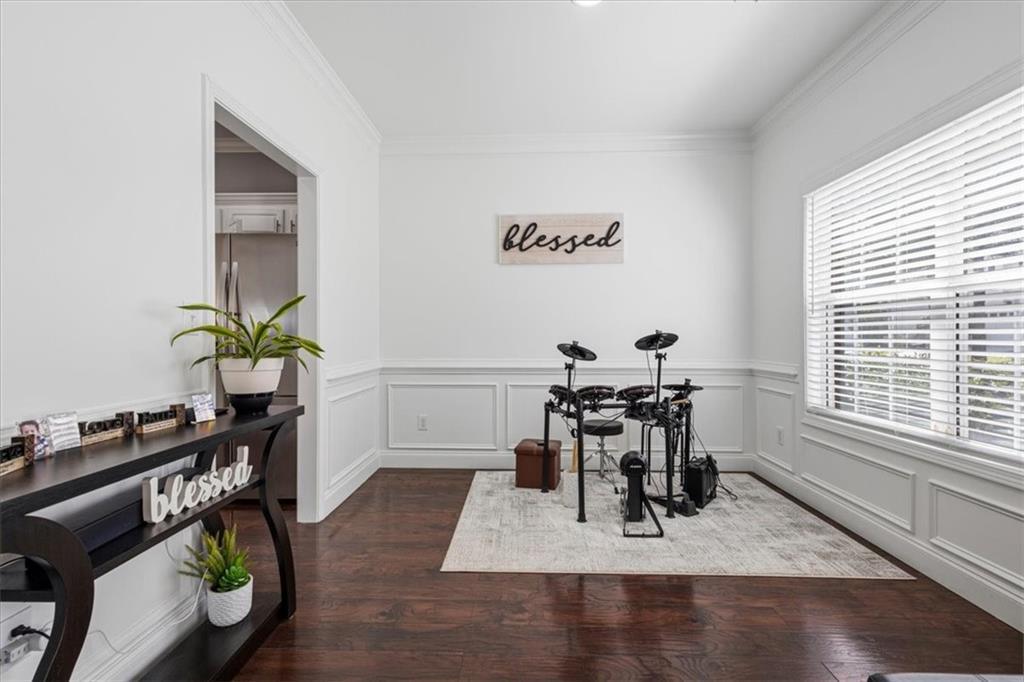 1380 Commonwealth Lane Grayson, GA 30017 - Photo 11 of 46 a dining room with wooden floor and a window