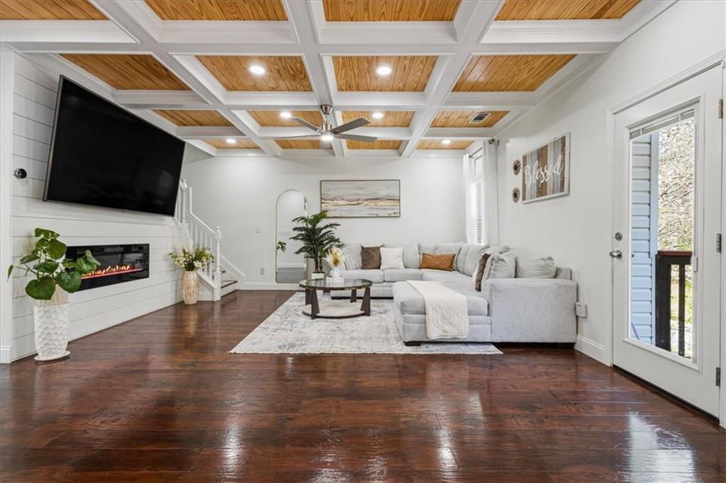1380 Commonwealth Lane Grayson, GA 30017 - Photo 18 of 46 a living room with furniture and a flat screen tv