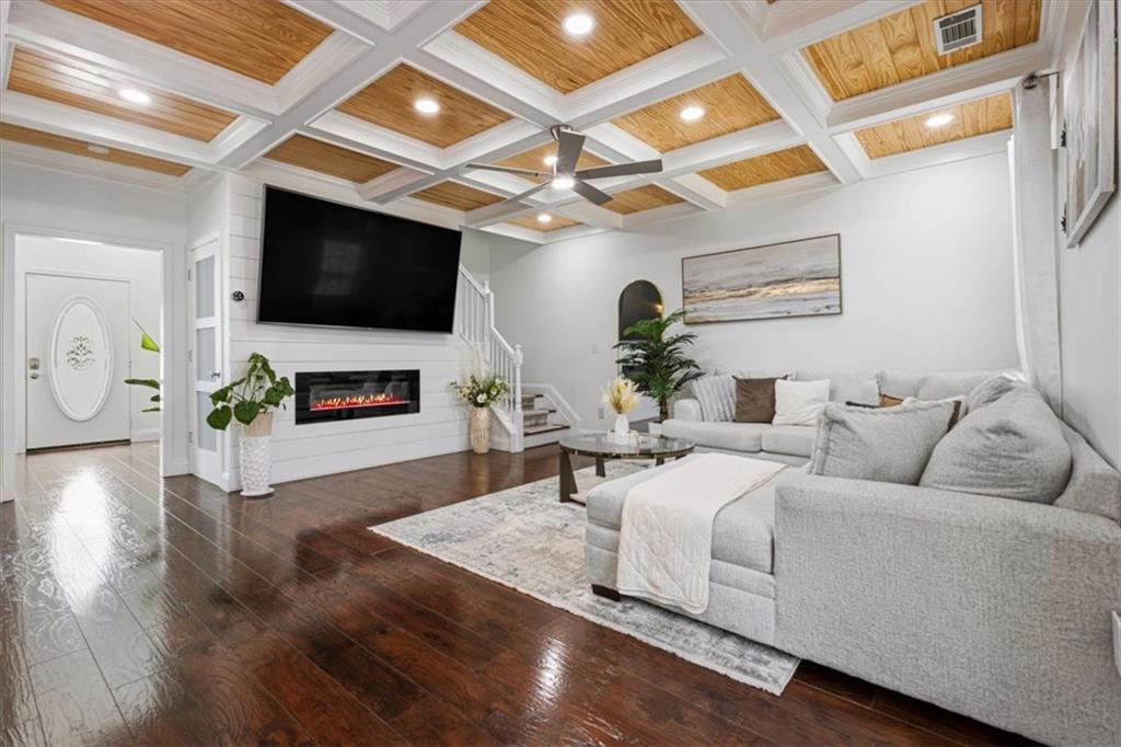 1380 Commonwealth Lane Grayson, GA 30017 - Photo 19 of 46 a living room with furniture and a flat screen tv