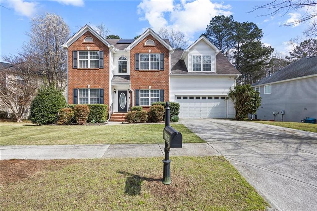 1380 Commonwealth Lane Grayson, GA 30017 - Photo 2 of 46 a front view of a house with garden