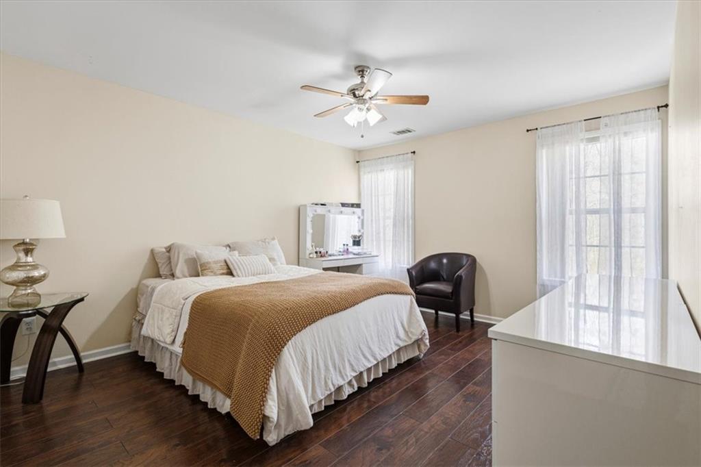 1380 Commonwealth Lane Grayson, GA 30017 - Photo 21 of 46 a bedroom with bed and window