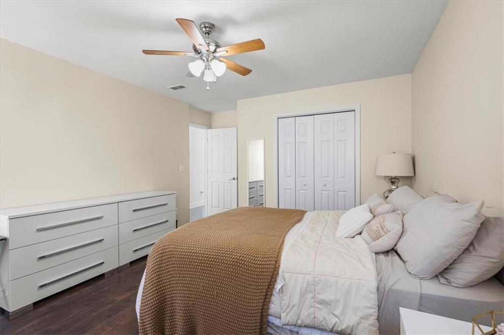 1380 Commonwealth Lane Grayson, GA 30017 - Photo 22 of 46 a bedroom with a bed and a chandelier