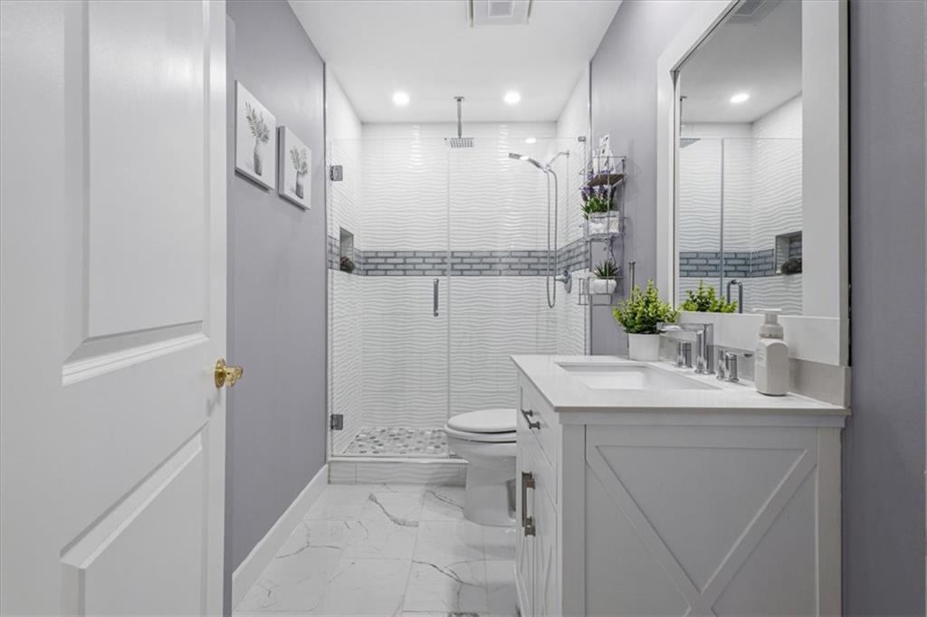 1380 Commonwealth Lane Grayson, GA 30017 - Photo 35 of 46 a bathroom with a sink toilet and shower
