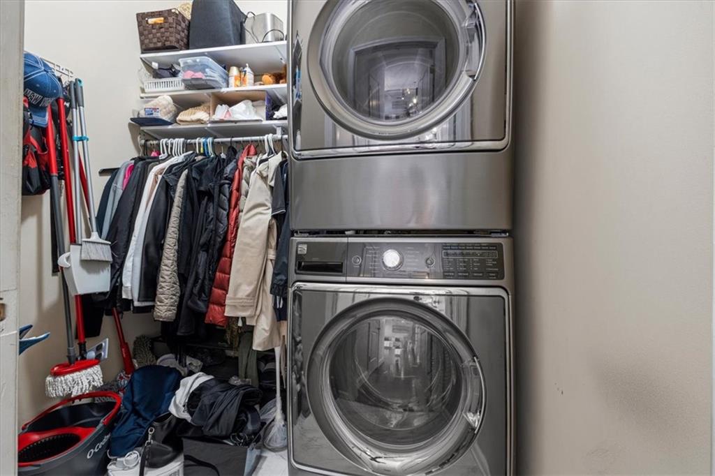 1380 Commonwealth Lane Grayson, GA 30017 - Photo 41 of 46 a view of walk in closet with clothes and shoes