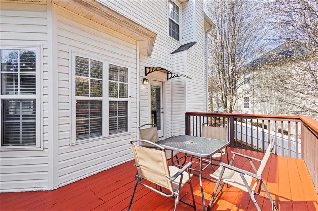 1380 Commonwealth Lane Grayson, GA 30017 - Photo 9 of 46 a balcony with table and chairs